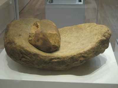 An Early Neolithic (3700 - 3500 BC) saddle quern and rubbing stone, image courtesy of wiktionary.org